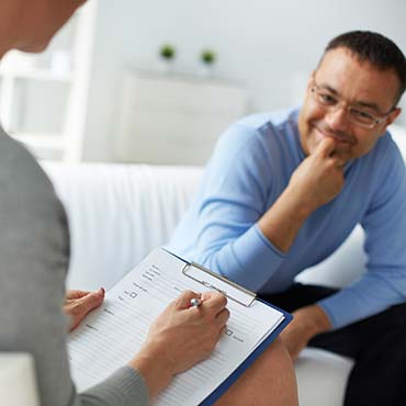 Counselor with client performing an evaluation