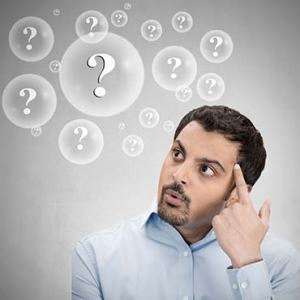 Man thinking with question marks in bubble cloud